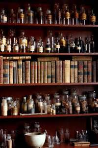 Alchemist book and bottles on shelf